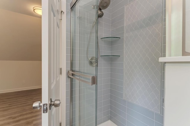 1927 Lakewood Dr, Wilmington, IL 60481 - bathroom with tiled shower and wood finished floors
