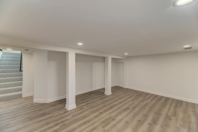 1927 Lakewood Dr, Wilmington, IL 60481 - finished below grade area featuring stairs, wood finished floors, and recessed lighting