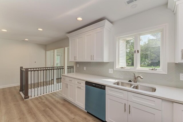 1927 Lakewood Dr, Wilmington, IL 60481 - kitchen featuring dishwasher, light countertops, white cabinets, recessed lighting, and tasteful backsplash
