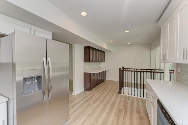 1927 Lakewood Dr, Wilmington, IL 60481 - kitchen featuring appliances with stainless steel finishes, light countertops, light wood-style floors, white cabinets, and recessed lighting