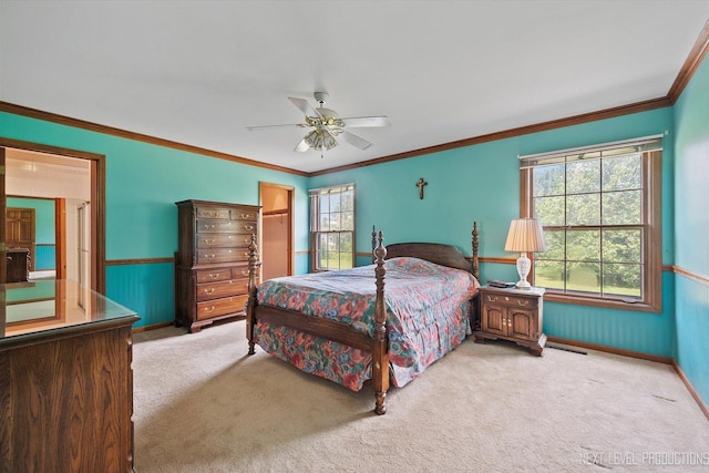 3609 Tamarisk Ct, Crystal Lake, IL 60012 - carpeted bedroom with crown molding, wainscoting, a ceiling fan, a spacious closet, and a closet