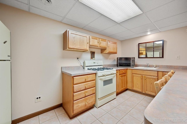 3609 Tamarisk Ct, Crystal Lake, IL 60012 - kitchen featuring white appliances, a drop ceiling, light tile patterned floors, light countertops, and light brown cabinetry