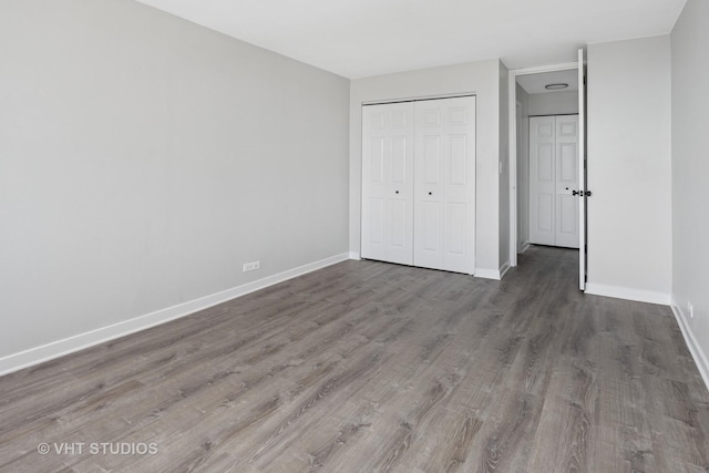 655 W Irving Park Rd Unit 2608, Chicago, IL 60613 - unfurnished bedroom with wood finished floors and a closet