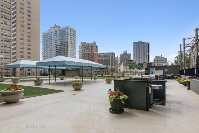 655 W Irving Park Rd Unit 2608, Chicago, IL 60613 - surrounding community with a view of skyline and a gazebo