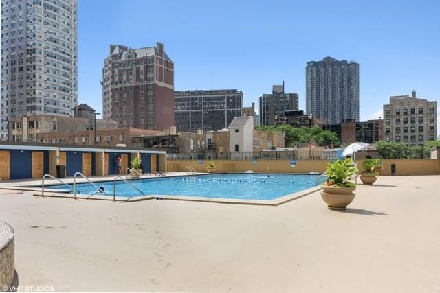 655 W Irving Park Rd Unit 2608, Chicago, IL 60613 - community pool featuring a view of skyline and a patio area