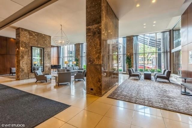 655 W Irving Park Rd Unit 2608, Chicago, IL 60613 - community lobby with a high ceiling, floor to ceiling windows, and recessed lighting