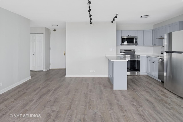 655 W Irving Park Rd Unit 2608, Chicago, IL 60613 - kitchen with appliances with stainless steel finishes, light wood-style flooring, light countertops, and gray cabinetry