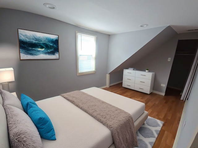 7417 S Saint Lawrence Ave, Chicago, IL 60619 - bedroom with wood finished floors and recessed lighting