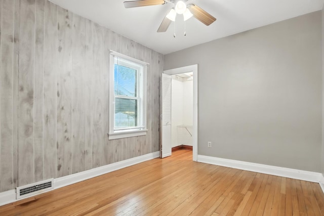 907 W Grove Ave, Waukegan, IL 60085 - empty room with hardwood / wood-style flooring and ceiling fan
