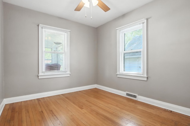 907 W Grove Ave, Waukegan, IL 60085 - empty room with wood-type flooring and ceiling fan