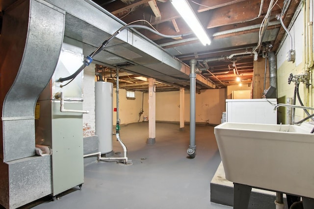 907 W Grove Ave, Waukegan, IL 60085 - unfinished below grade area with gas water heater, heating unit, and washer / clothes dryer