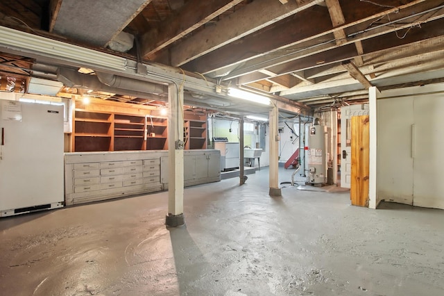 907 W Grove Ave, Waukegan, IL 60085 - unfinished below grade area with gas water heater, washer / dryer, and freestanding refrigerator