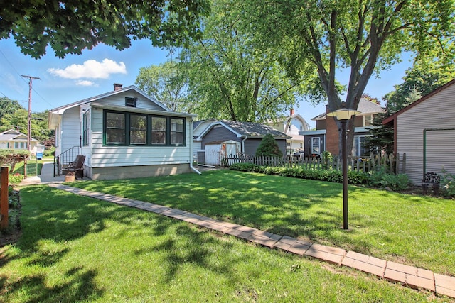 907 W Grove Ave, Waukegan, IL 60085 - view of front of house with entry steps and a storage shed