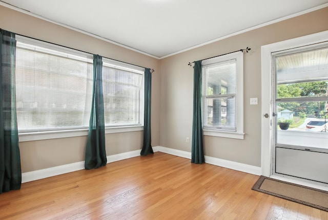 907 W Grove Ave, Waukegan, IL 60085 - empty room with ornamental molding and light wood-style flooring