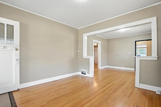 907 W Grove Ave, Waukegan, IL 60085 - spare room with light wood-style flooring and crown molding