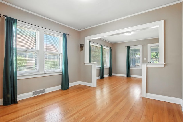 907 W Grove Ave, Waukegan, IL 60085 - spare room featuring light wood-type flooring and crown molding