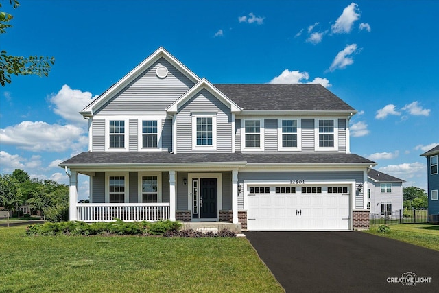 12501 S Willowgate Ln, Plainfield, IL 60585 - view of front of house with a porch, a garage, driveway, and brick siding