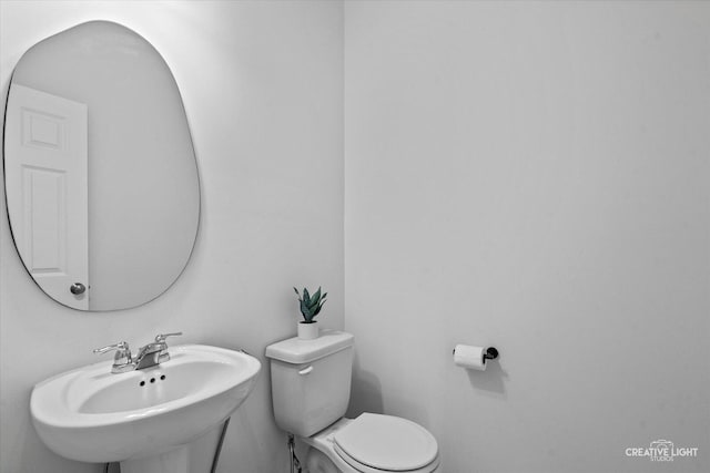 12501 S Willowgate Ln, Plainfield, IL 60585 - half bathroom with a sink and toilet