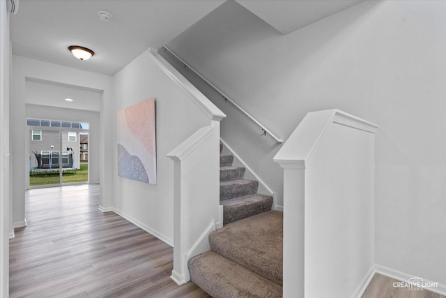 12501 S Willowgate Ln, Plainfield, IL 60585 - staircase with wood finished floors and baseboards