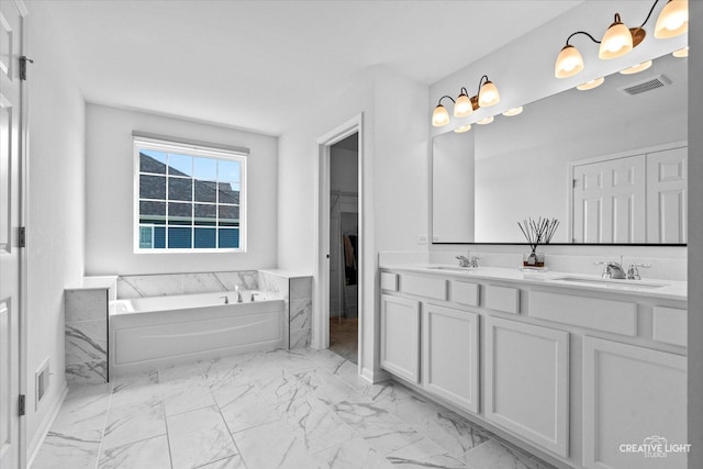 12501 S Willowgate Ln, Plainfield, IL 60585 - bathroom featuring marble finish flooring, a garden tub, and double vanity