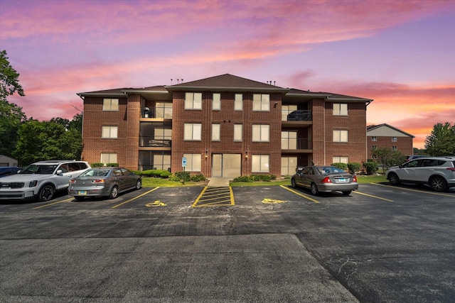 7020 Heritage Cir Unit 6-1D, Orland Park, IL 60462 - property at dusk with uncovered parking