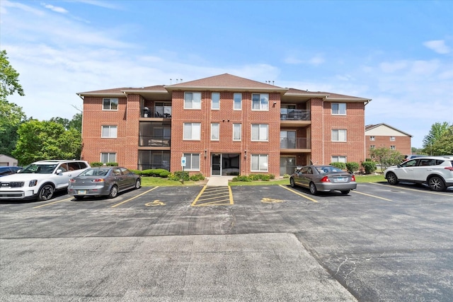 7020 Heritage Cir Unit 6-1D, Orland Park, IL 60462 - view of apartment building / complex featuring uncovered parking