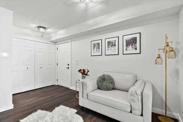 7020 Heritage Cir Unit 6-1D, Orland Park, IL 60462 - sitting room with dark wood-type flooring and a textured ceiling