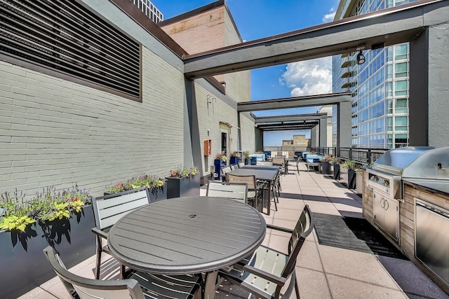 247 E Chestnut St Unit 502, Chicago, IL 60611 - view of patio / terrace featuring outdoor dining area, exterior kitchen, and a pergola