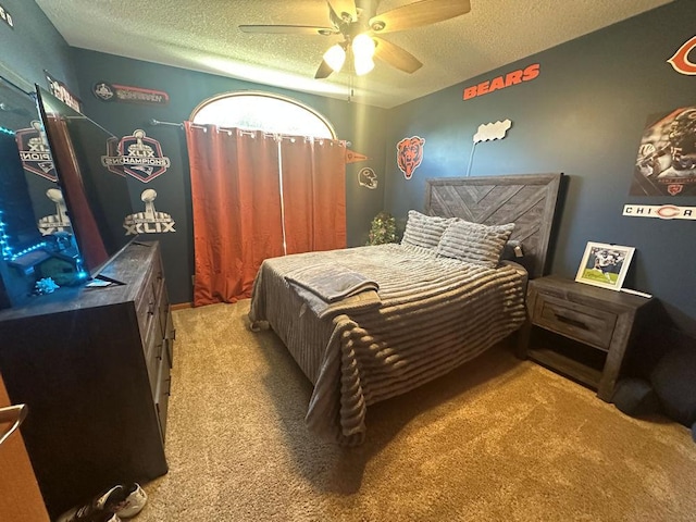 314 N Grove St, Rochelle, IL 61068 - bedroom featuring carpet floors, a textured ceiling, and a ceiling fan