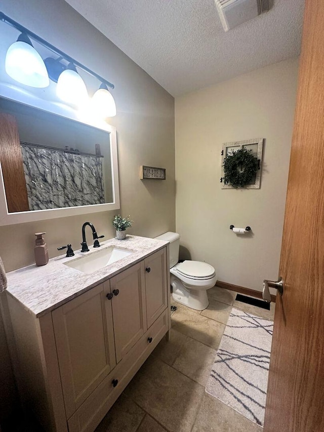 314 N Grove St, Rochelle, IL 61068 - bathroom with vanity, a textured ceiling, tile patterned floors, and vaulted ceiling