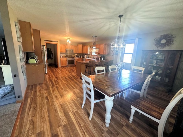 314 N Grove St, Rochelle, IL 61068 - dining space featuring wood finished floors and a chandelier
