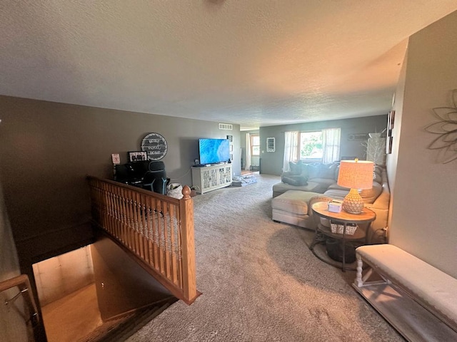 314 N Grove St, Rochelle, IL 61068 - living room featuring carpet floors and a textured ceiling