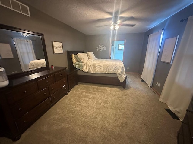 314 N Grove St, Rochelle, IL 61068 - bedroom with light carpet, a ceiling fan, and a textured ceiling