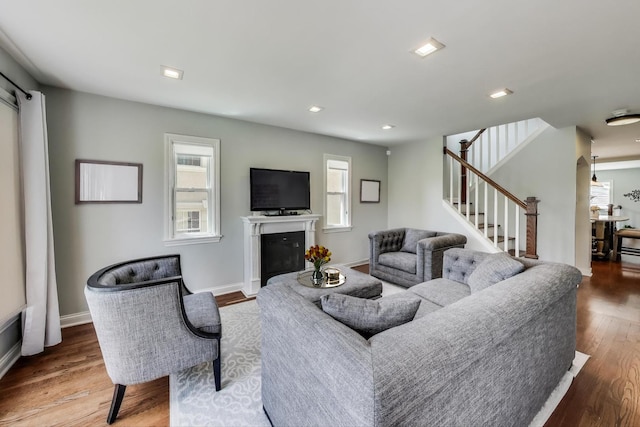 1832 N 73rd Ct, Elmwood Park, IL 60707 - living room featuring wood finished floors, a glass covered fireplace, stairway, and recessed lighting