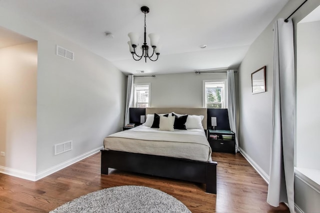 1832 N 73rd Ct, Elmwood Park, IL 60707 - bedroom with a chandelier and wood finished floors