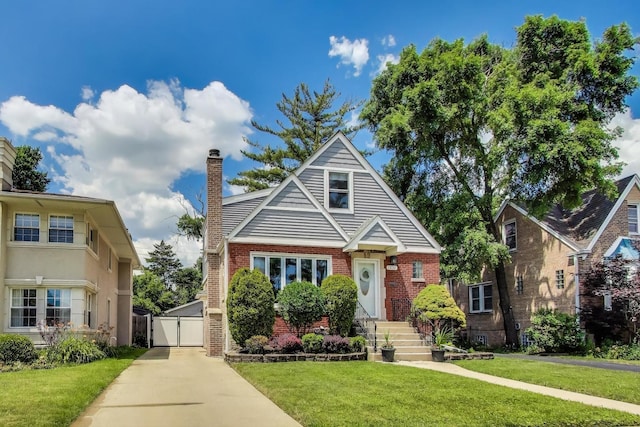 1832 N 73rd Ct, Elmwood Park, IL 60707 - bungalow-style house featuring a chimney, brick siding, a front lawn, and a gate