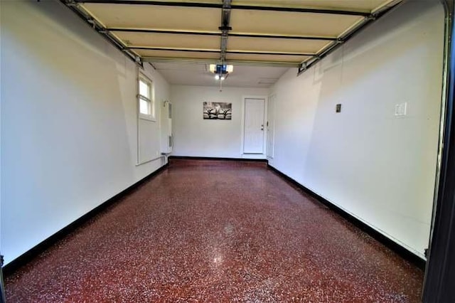 700 Delphia Ave, Elk Grove Village, IL 60007 - garage with a garage door opener and baseboards