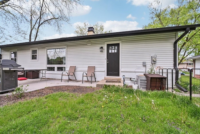 700 Delphia Ave, Elk Grove Village, IL 60007 - rear view of property with a chimney and a patio