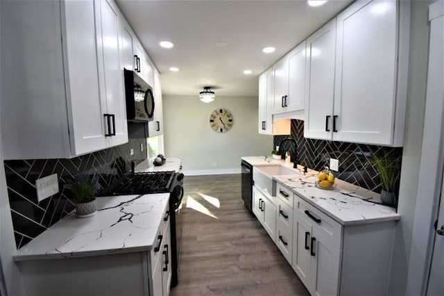 700 Delphia Ave, Elk Grove Village, IL 60007 - kitchen with black appliances, recessed lighting, wood finished floors, tasteful backsplash, and white cabinets