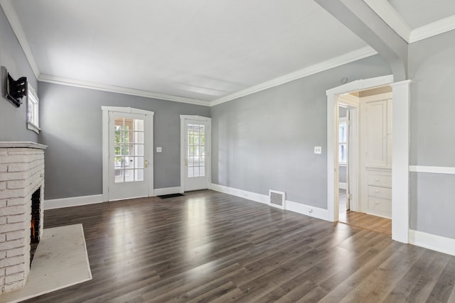 207 Smith Ave, Rockford, IL 61107 - unfurnished living room with a brick fireplace, wood finished floors, and crown molding