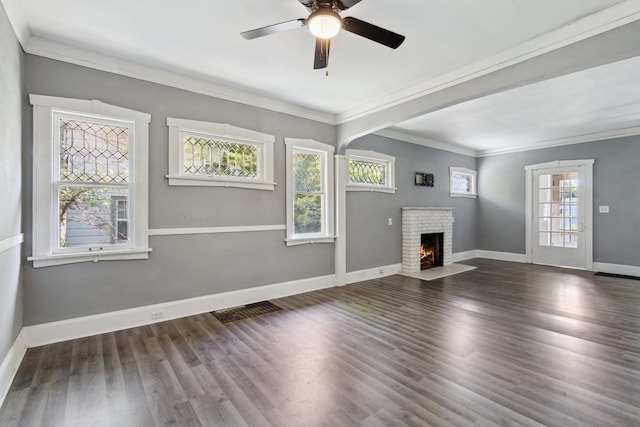 207 Smith Ave, Rockford, IL 61107 - unfurnished living room featuring crown molding, a fireplace, ceiling fan, and wood finished floors