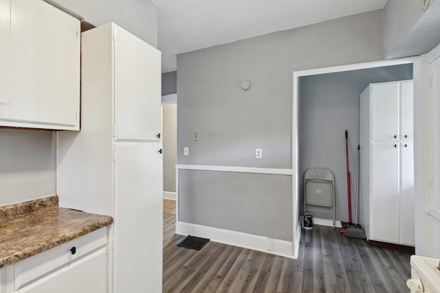 207 Smith Ave, Rockford, IL 61107 - kitchen featuring dark wood-style flooring and white cabinetry