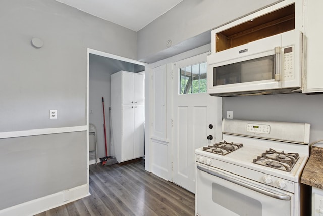 207 Smith Ave, Rockford, IL 61107 - kitchen featuring white appliances, dark wood-style flooring, and light countertops
