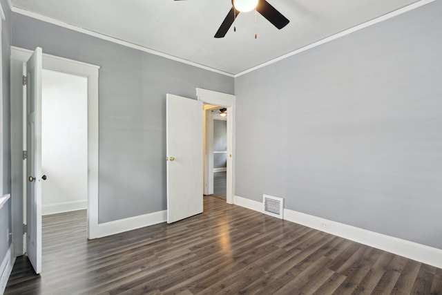 207 Smith Ave, Rockford, IL 61107 - unfurnished bedroom featuring dark wood-type flooring, ornamental molding, and ceiling fan