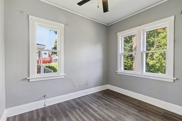207 Smith Ave, Rockford, IL 61107 - empty room with dark wood finished floors, ceiling fan, and ornamental molding