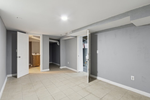 207 Smith Ave, Rockford, IL 61107 - finished below grade area featuring baseboards and light tile patterned floors