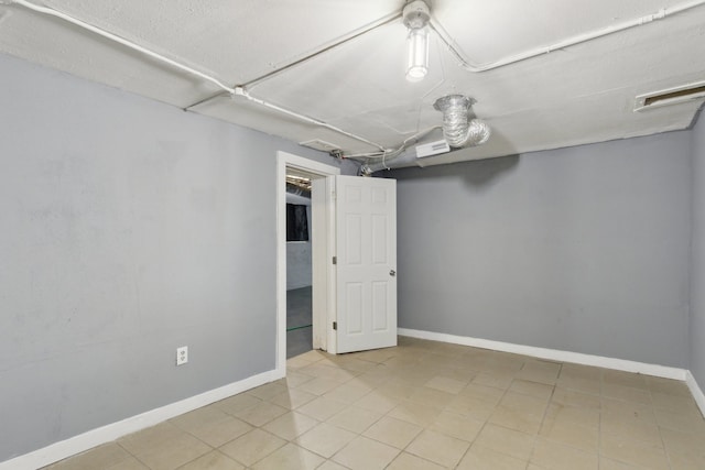 207 Smith Ave, Rockford, IL 61107 - finished basement with baseboards and tile patterned floors