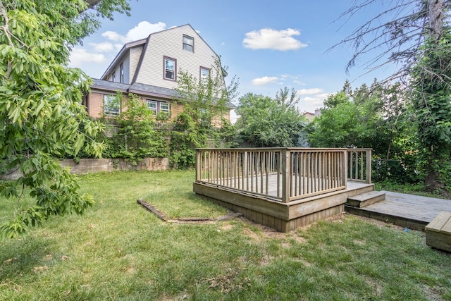 207 Smith Ave, Rockford, IL 61107 - view of green lawn with a wooden deck