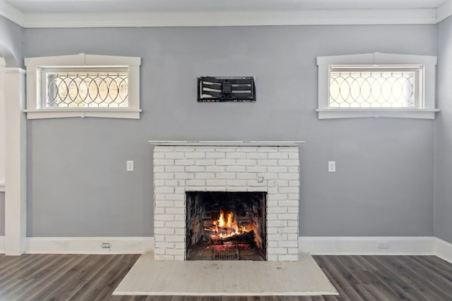 207 Smith Ave, Rockford, IL 61107 - detailed view of wood finished floors, a fireplace, and ornamental molding