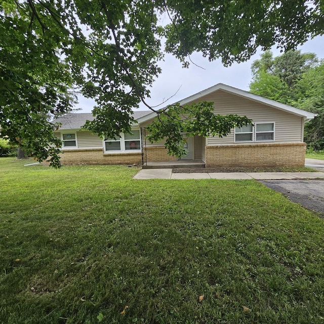 4428 Virginia Ave, Rockford, IL 61101 - view of front of property with brick siding and a front lawn